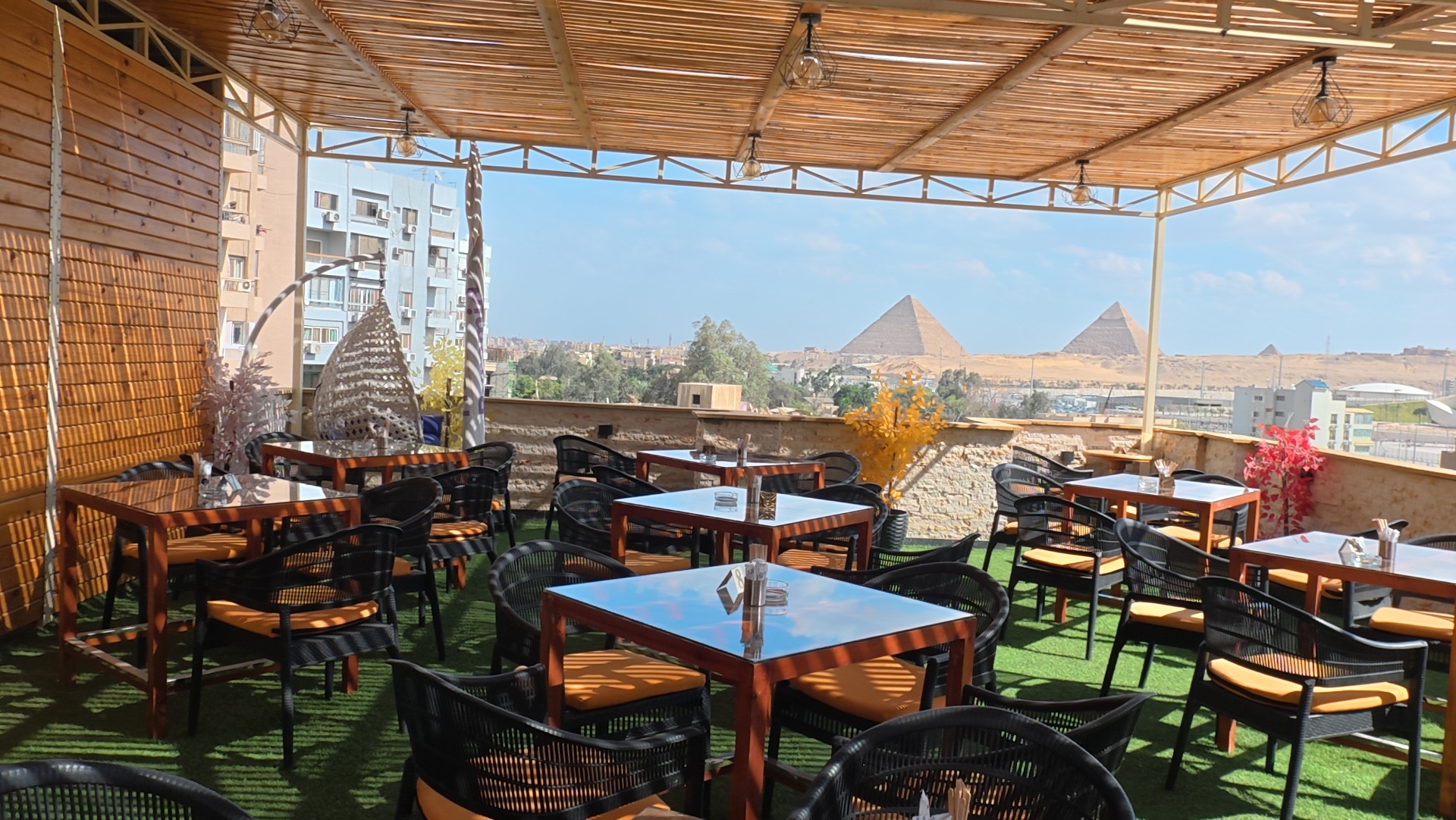 Rooftop terrace at Grand View facing the Grand Egyptian Museum